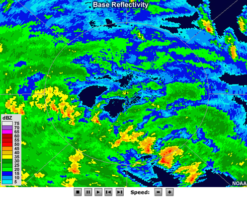 Radar reflectivity animation showing bands of intense precipitation spiraling couterclockwise about a ring of more intense precipitation with an echo-free region in its center. Several strong, discrete cells are embedded within the northernmost rainbands.