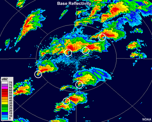 Intensely precipitating separate cells exist over much of the radar range. Some have hook echoes. Hook echoes are highlighted with white circles.